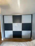 Checker board design in white glass and alby blue panel with champagne frames, fitted in Eaglescliffe (straight)